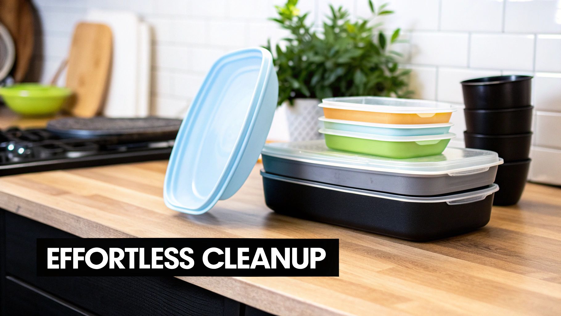 A variety of colorful, black, and grey meal prep containers on a wooden kitchen counter.