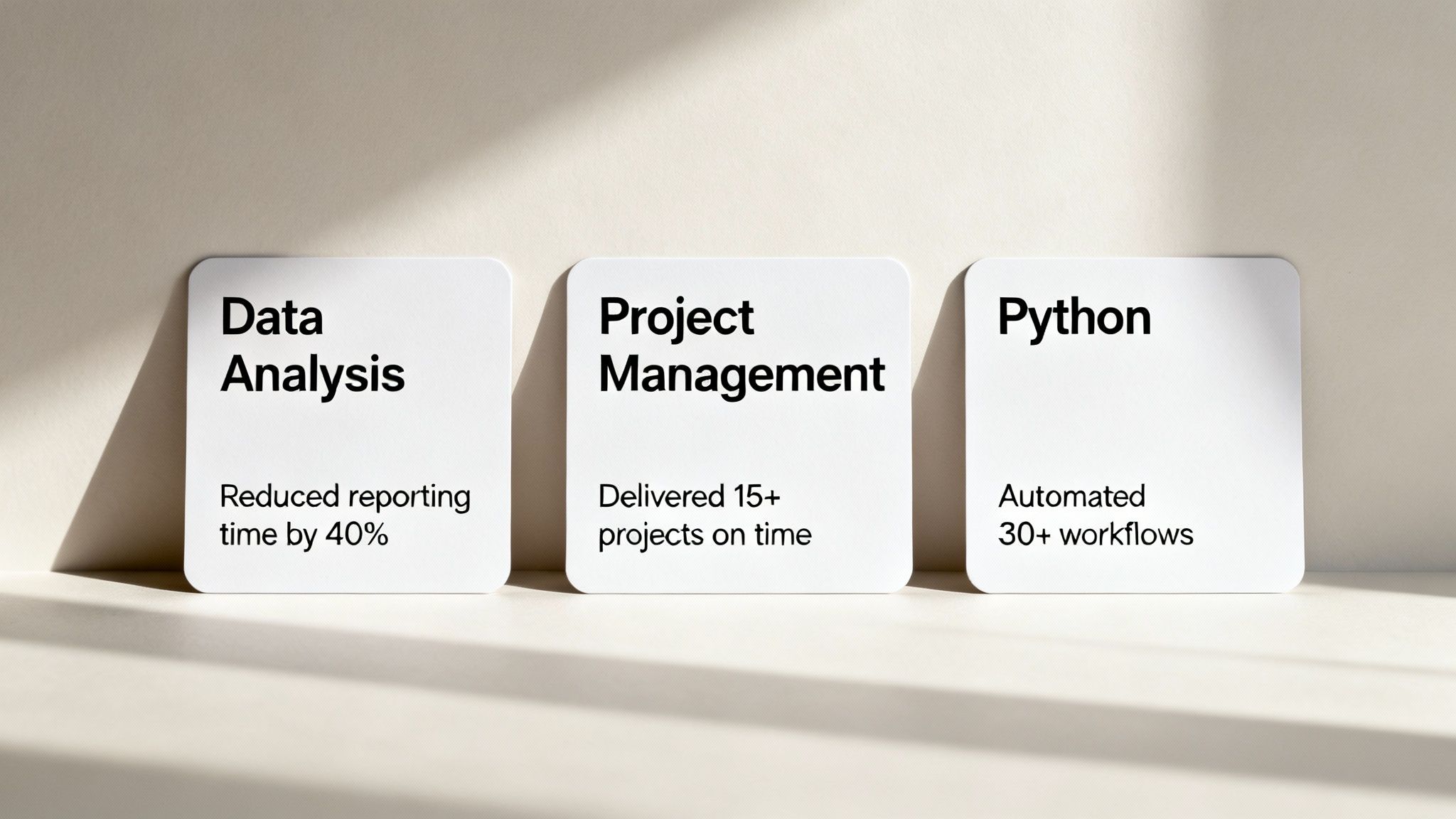 Three white cards displaying professional skills: data analysis, project management, and Python automation achievements
