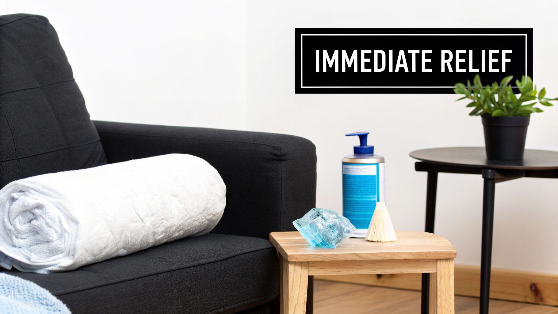 A cozy black armchair with a rolled white towel, a lotion bottle, and a sign reading 'IMMEDIATE RELIEF' on the wall.