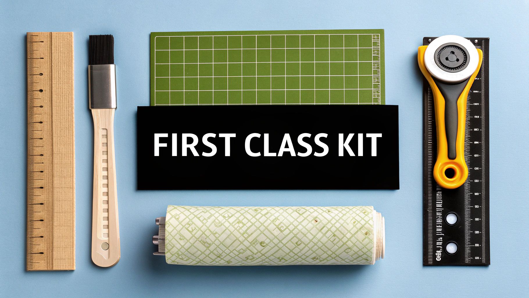 A collection of quilting supplies including a rotary cutter, mat, and colorful fabric.