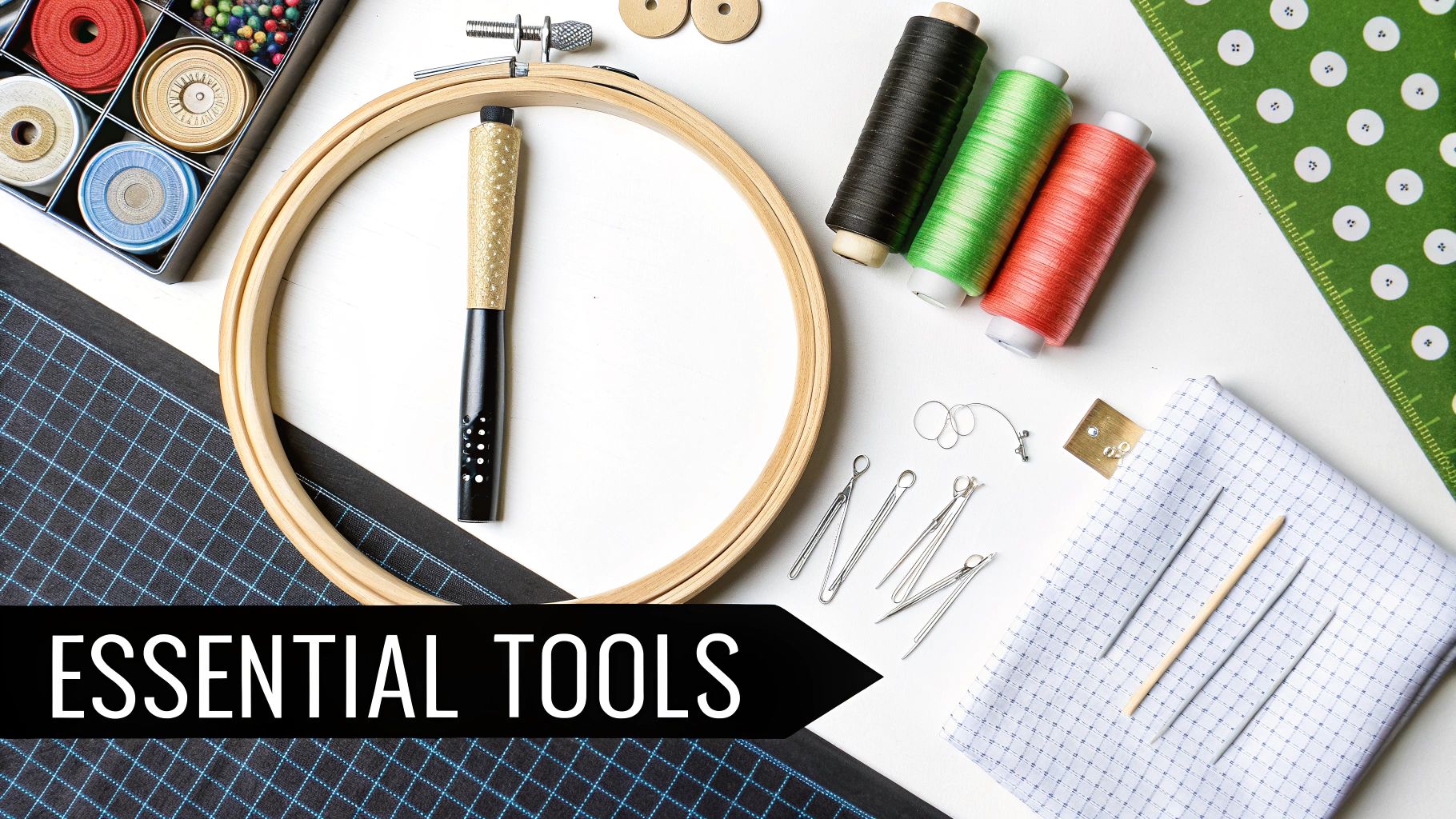 A flat lay of various essential sewing and crafting tools, including threads, an embroidery hoop, and needles.