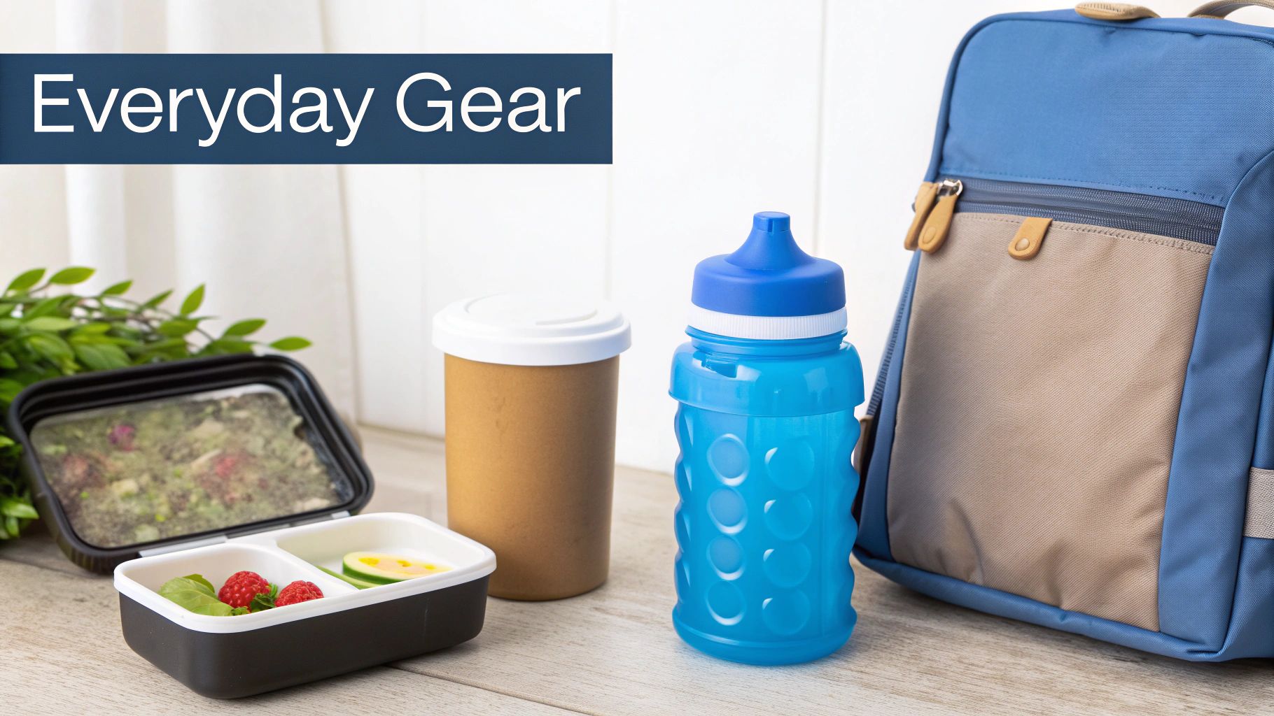 Everyday essentials: a lunchbox with food, an insulated cup, a blue water bottle, and a backpack.