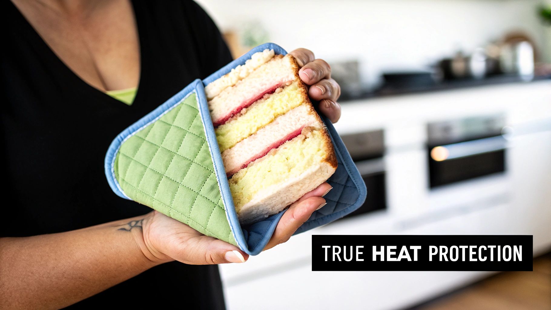 Person holding a layered cake slice with a green quilted potholder in a kitchen, demonstrating heat protection.