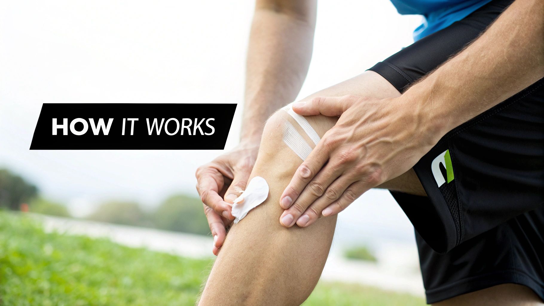 Athlete applies joint pain relief cream to their knee, taped with athletic strips, in an outdoor setting.