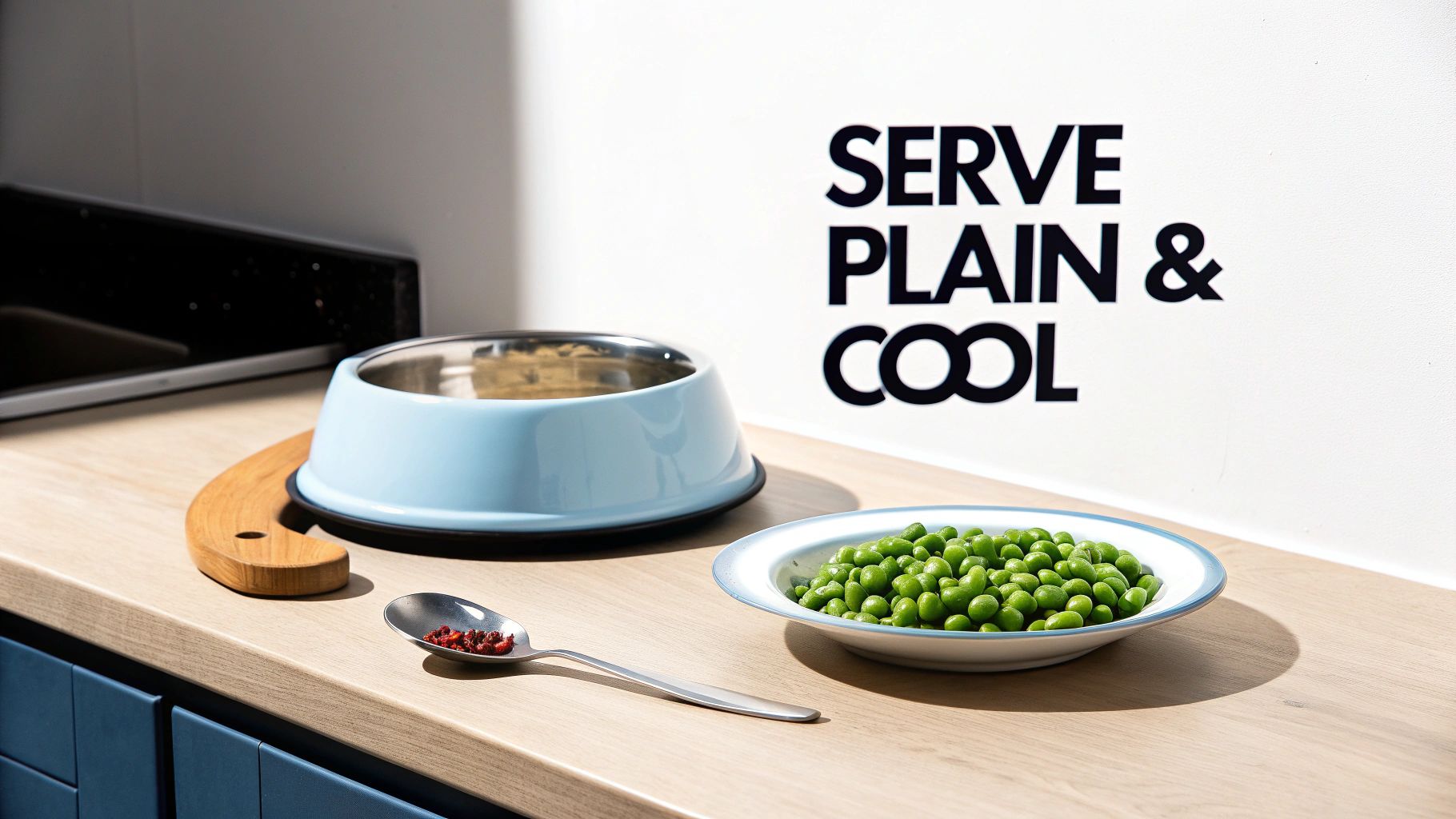 A light blue pet food bowl, a white bowl of green peas, and a spoon with treats on a countertop.