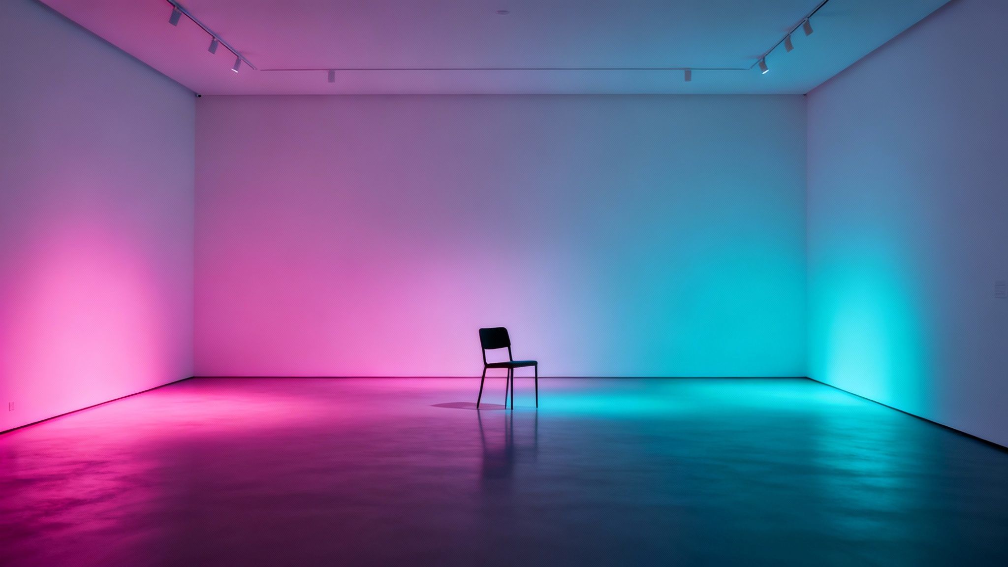 An empty room with a black chair, illuminated by vibrant pink and teal gradient lighting.