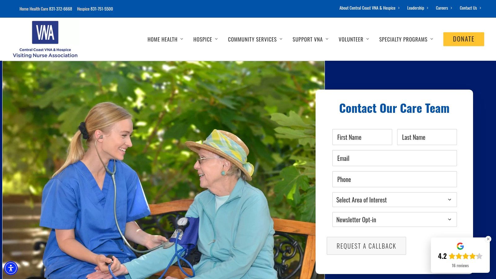 A compassionate healthcare provider sits with an elderly patient, reviewing documents together in a comfortable home setting, illustrating dedicated, in-home care.