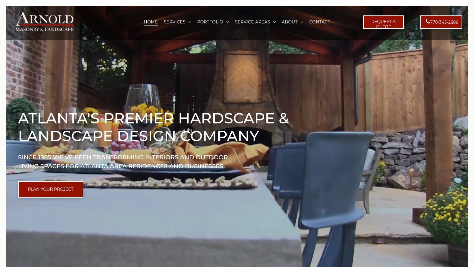 A professionally installed stone patio with integrated landscaping and outdoor furniture, showcasing local hardscape design.