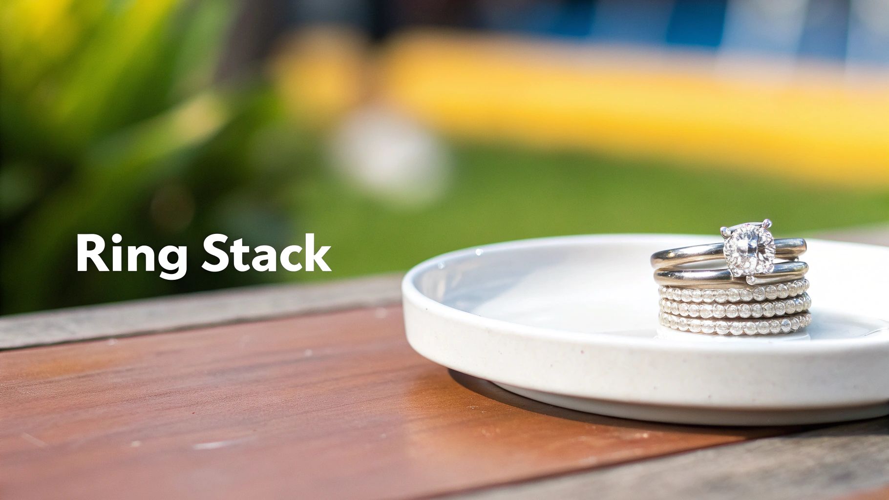 A collection of beautiful stackable diamond rings arranged on a surface.