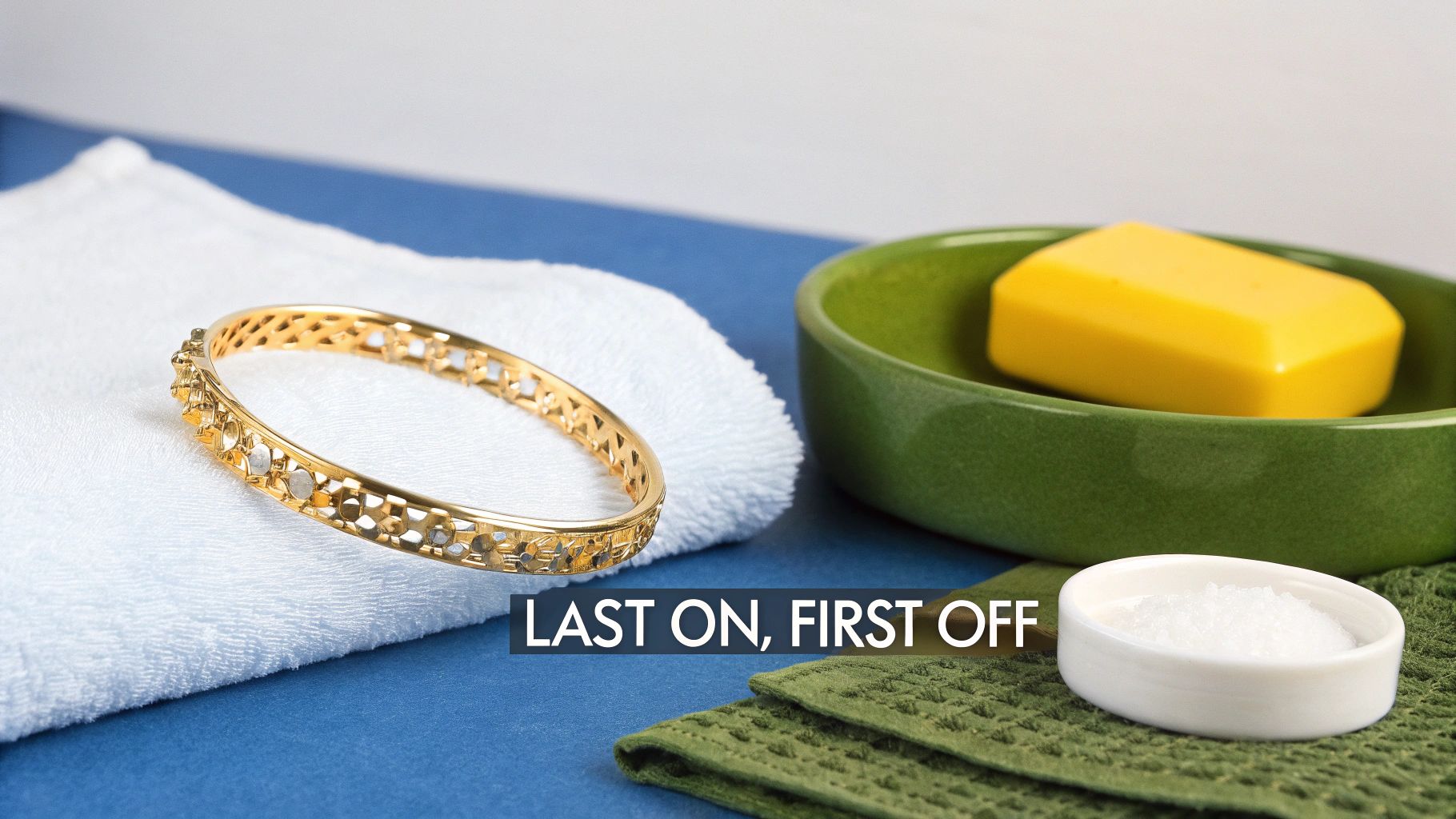 A close-up of a person carefully cleaning a piece of gold vermeil jewelry.