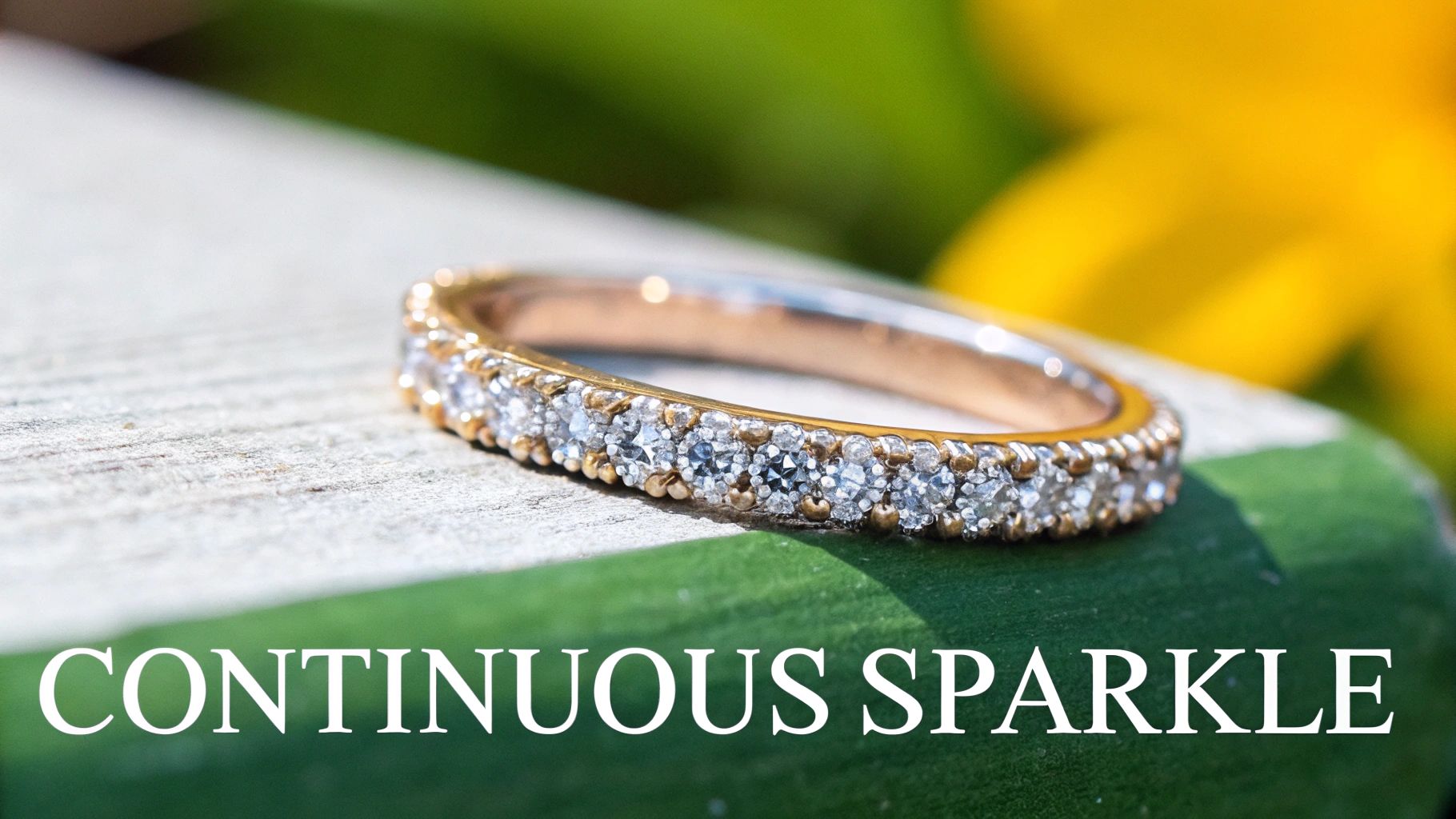 A close-up of a sparkling pavé diamond ring, showing the intricate detail of the small stones set along the band.