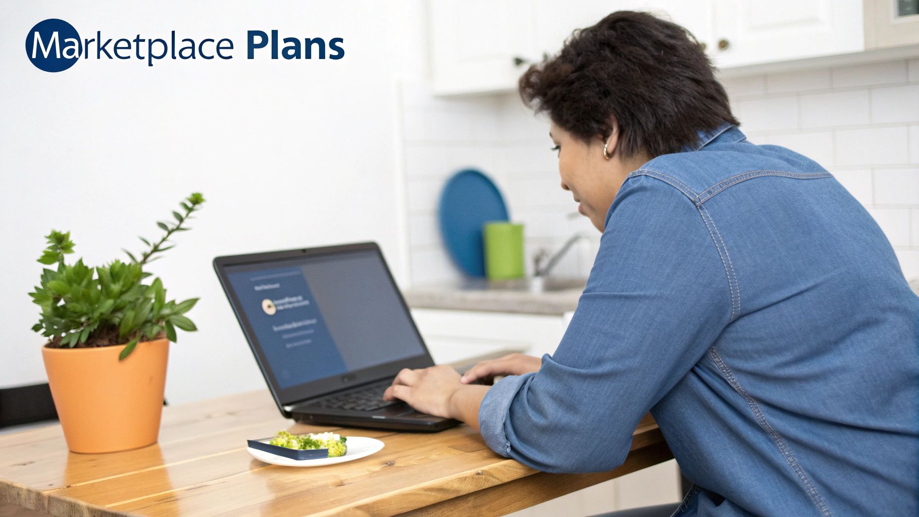 Person in a denim shirt using a laptop at a wooden kitchen table, viewing 'Marketplace Plans' on screen.