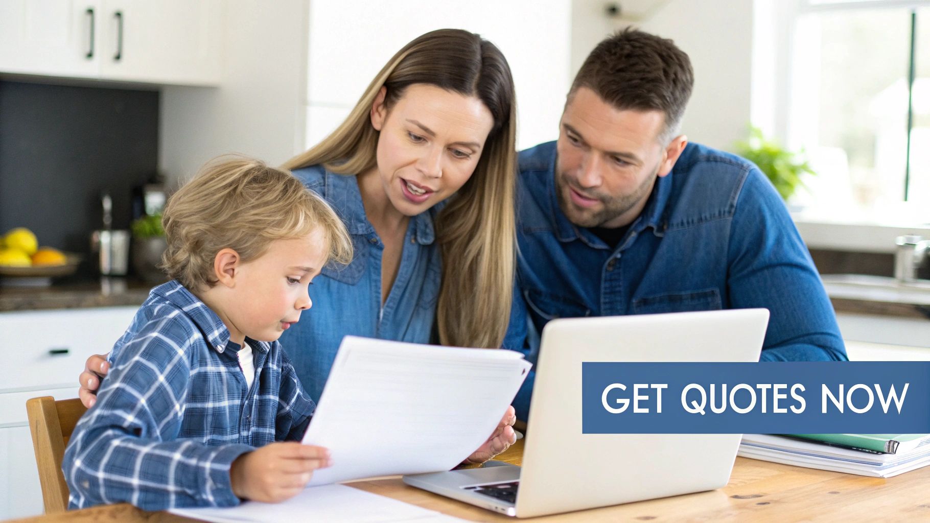 A family, parents and child, reviewing documents and a laptop together at a kitchen table.