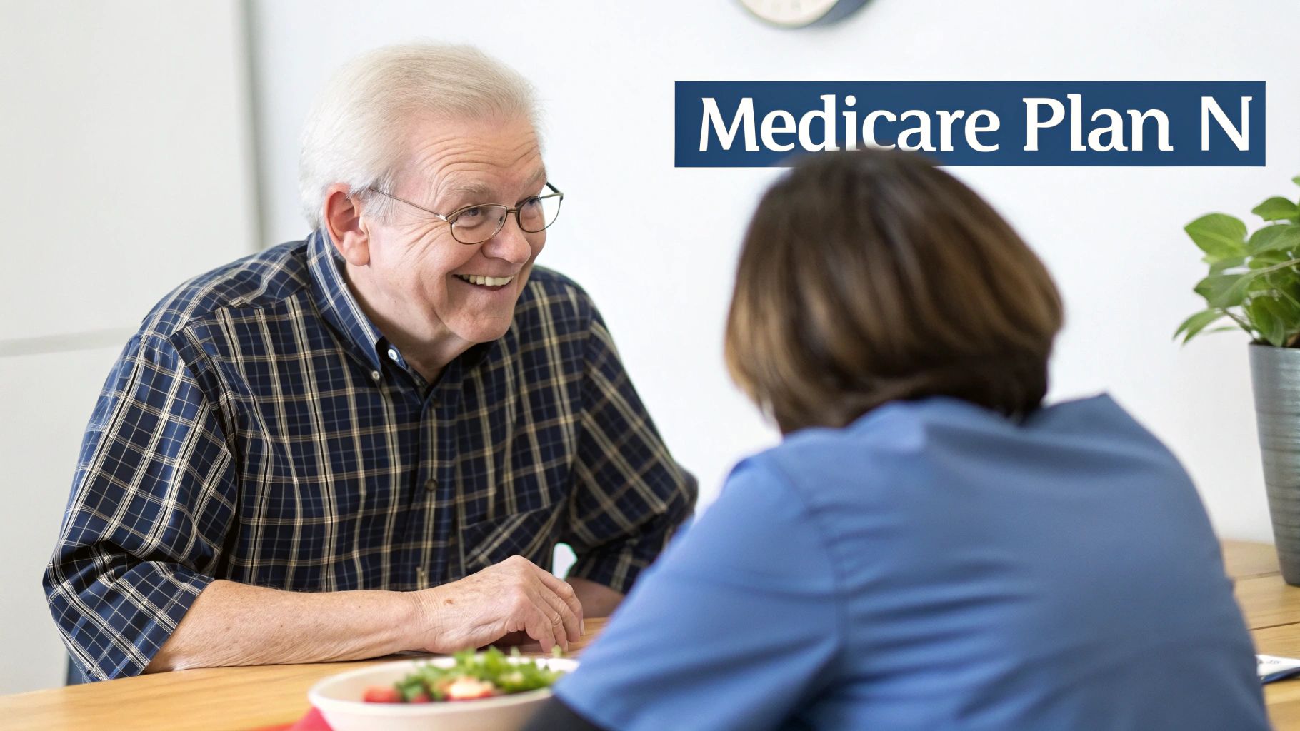 Smiling senior man discussing Medicare Plan N with a healthcare professional.