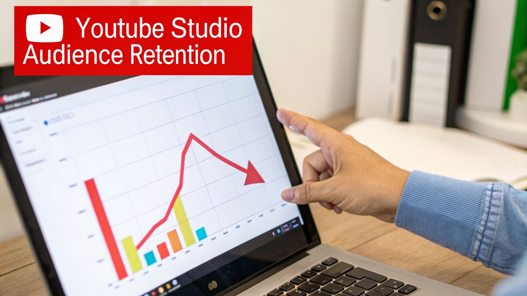 Hand pointing at a laptop displaying YouTube Studio audience retention graph showing a significant decline.