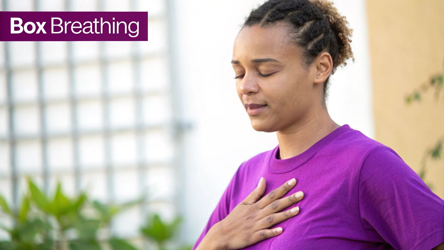A woman with closed eyes and hand on chest practices box breathing for mindfulness.
