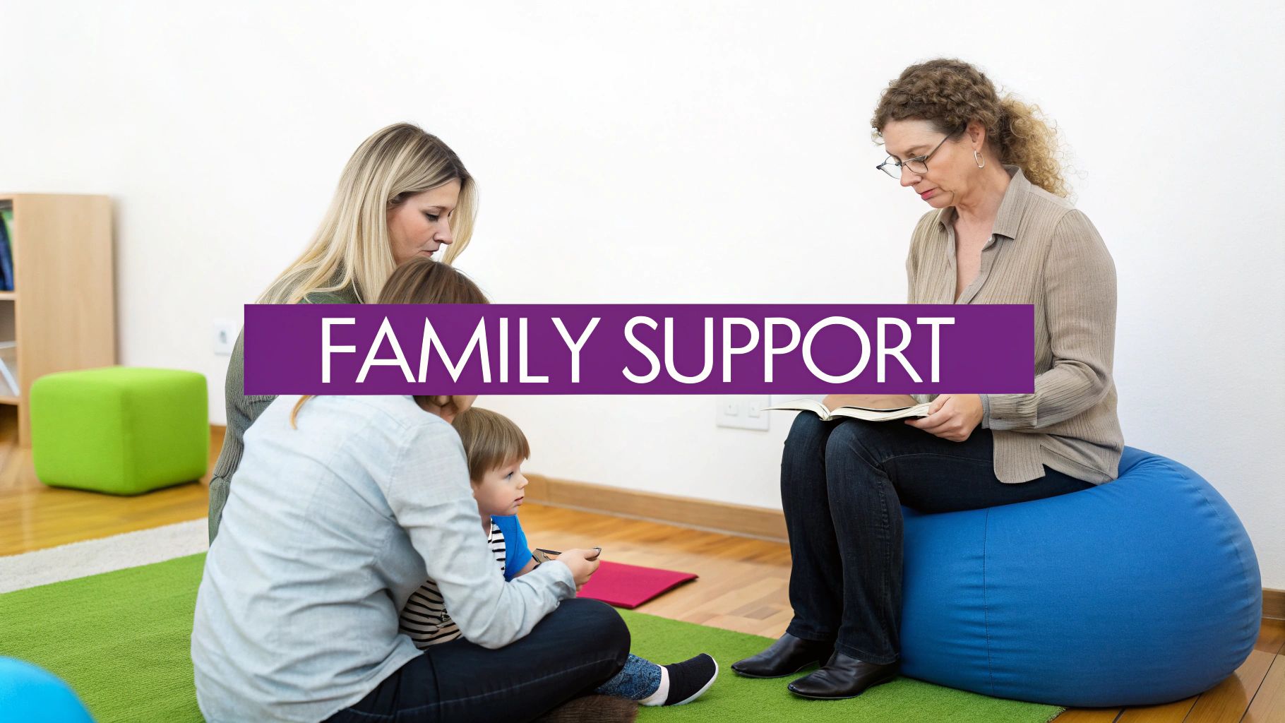 A therapist reads to a family with a child on a green rug, promoting family support.