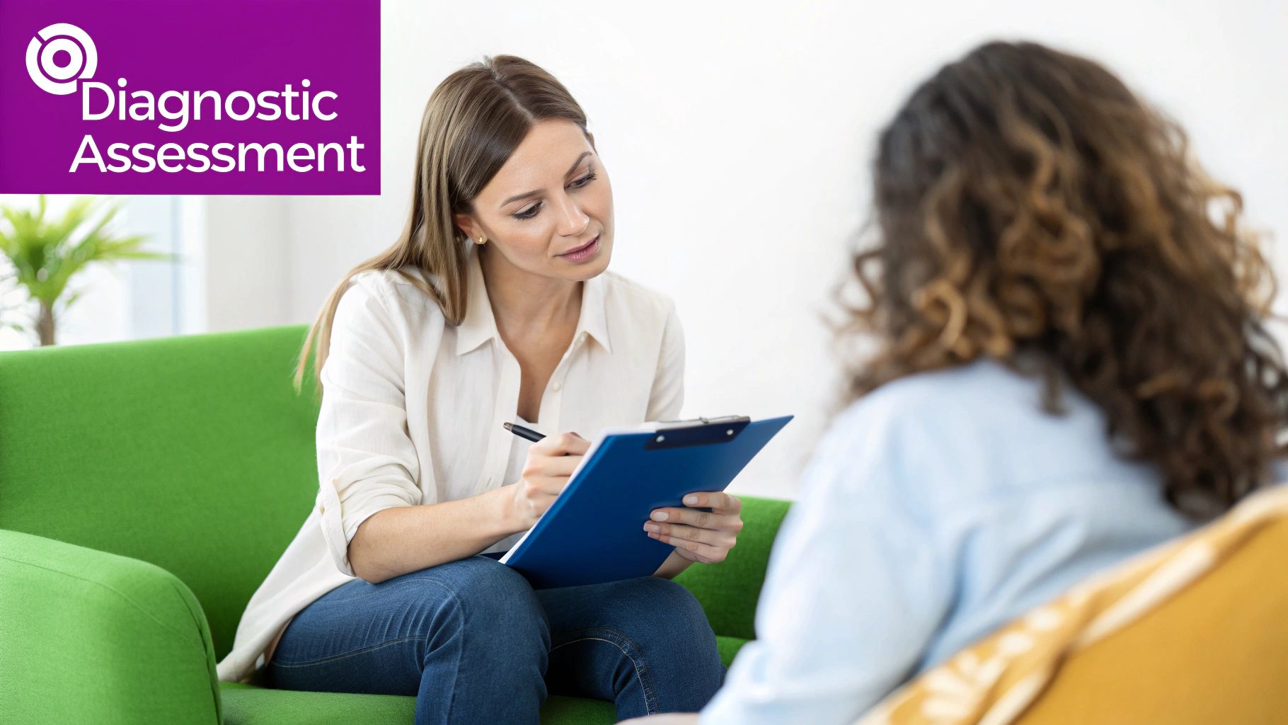 A female therapist conducts a diagnostic assessment with a client, taking notes on a clipboard.