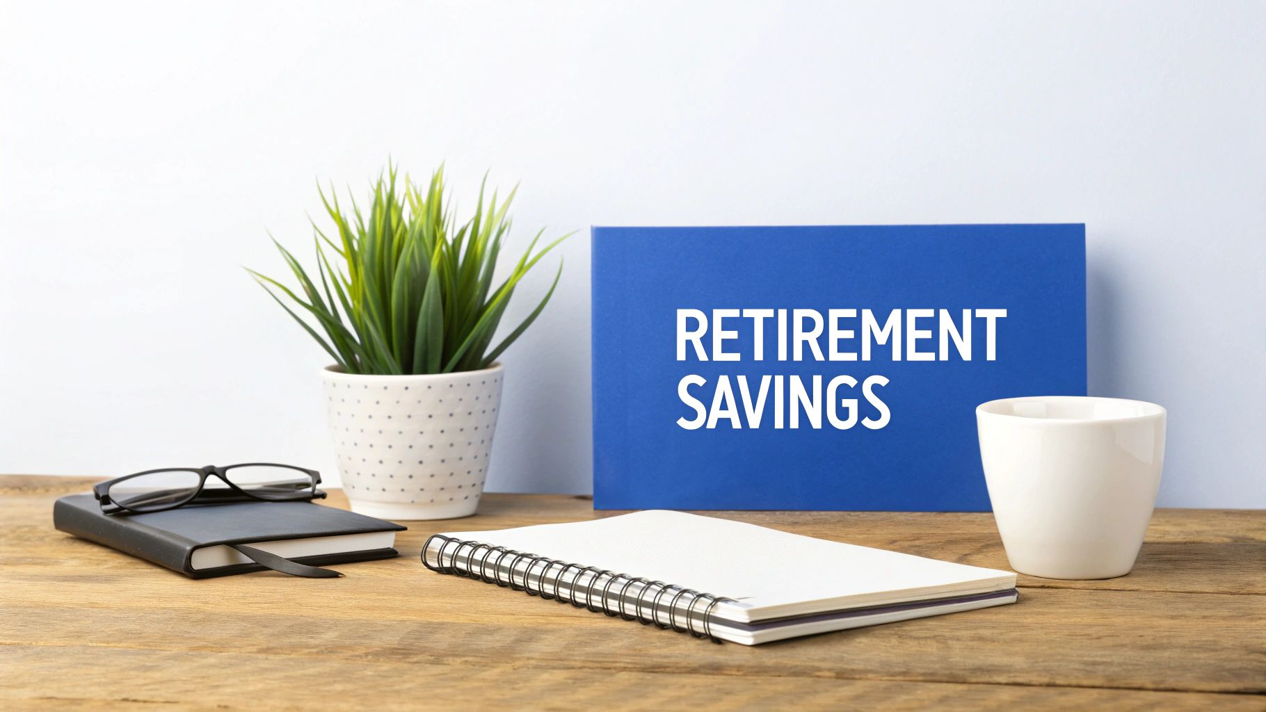 A person sitting at a desk with a calculator and documents, planning their retirement savings.