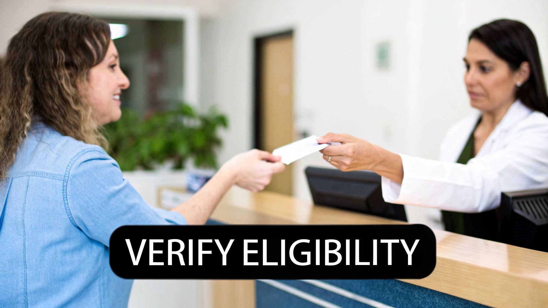 A smiling patient hands an insurance card to a healthcare provider at a clinic reception desk.