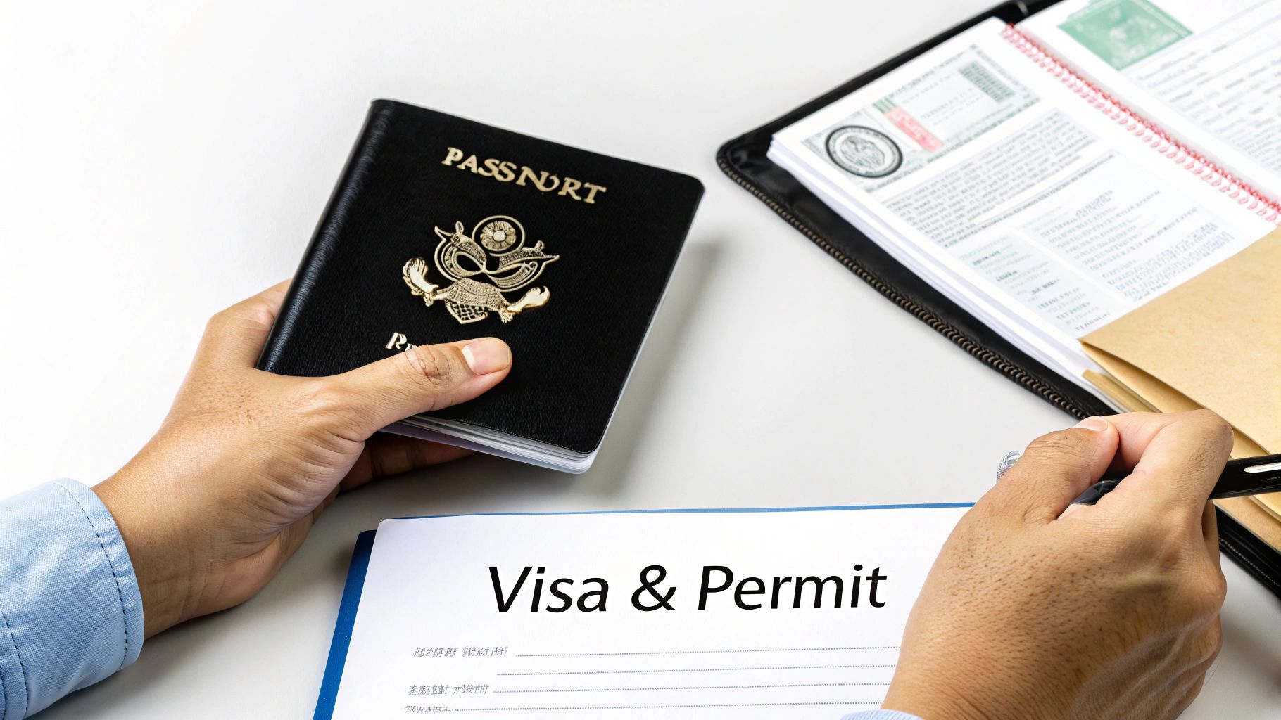 A person holding a black passport, filling out a 'Visa & Permit' application form on a white desk.