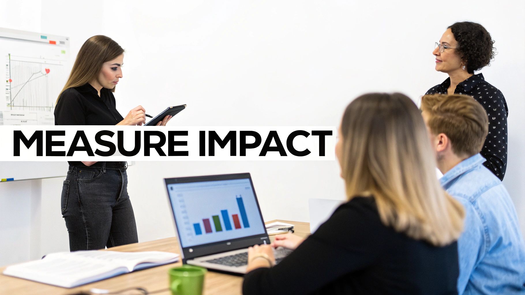 People in a business meeting measuring impact, with one woman presenting data and others collaborating.