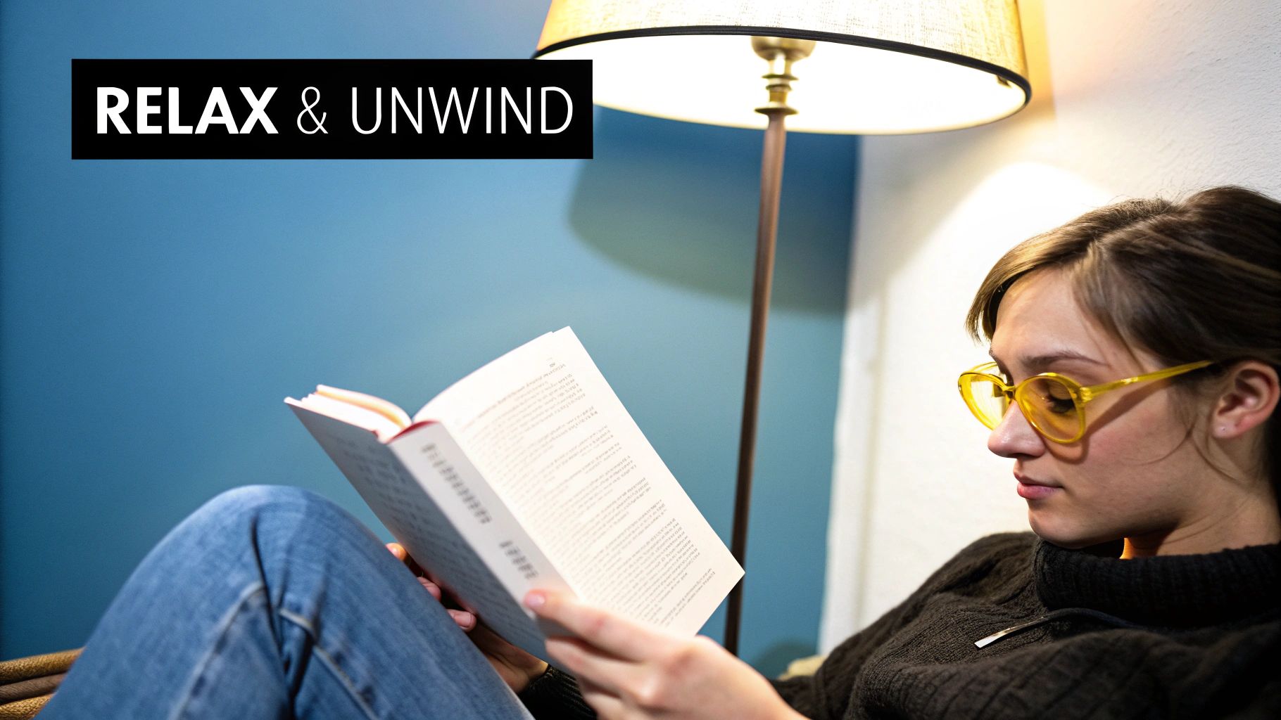 Person relaxing in the evening wearing Element Lux blue light blocking glasses