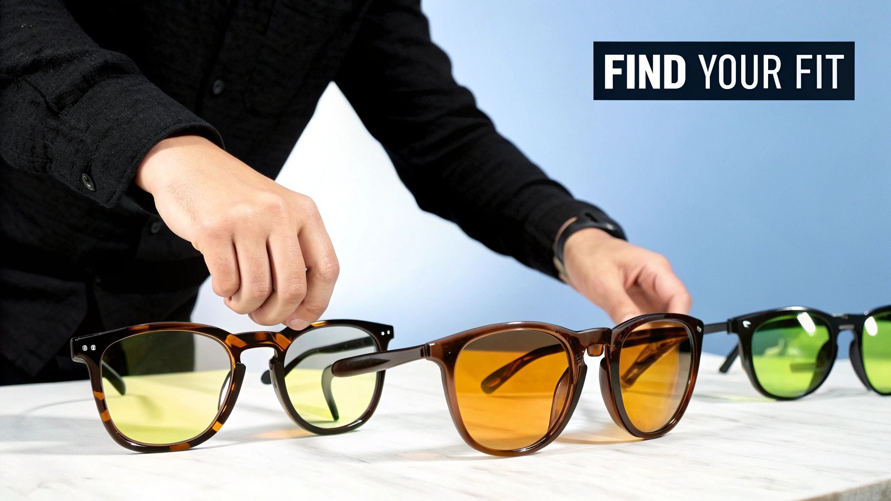 A pair of Element Lux amber tinted glasses resting on a surface.