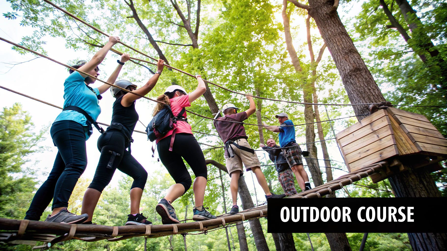 Team members participating in an outdoor ropes course challenge