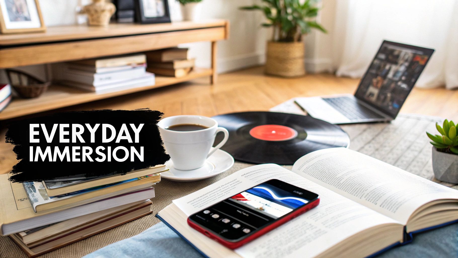 A cozy learning setup with books, coffee, vinyl record, and laptop, featuring 'Everyday Immersion'.