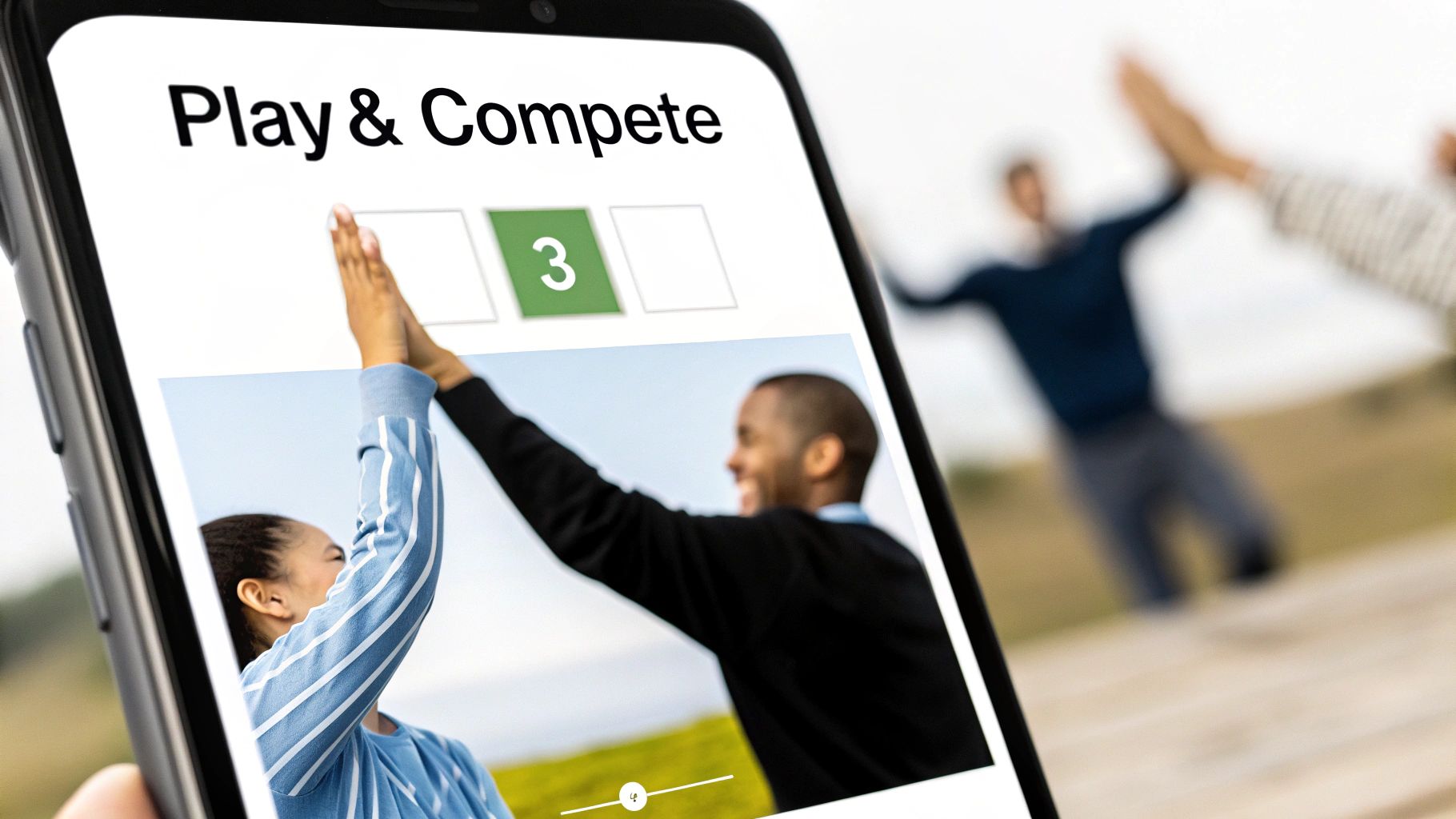 Close-up of a smartphone displaying a 'Play & Compete' app, showing people high-fiving, symbolizing teamwork and achievement.