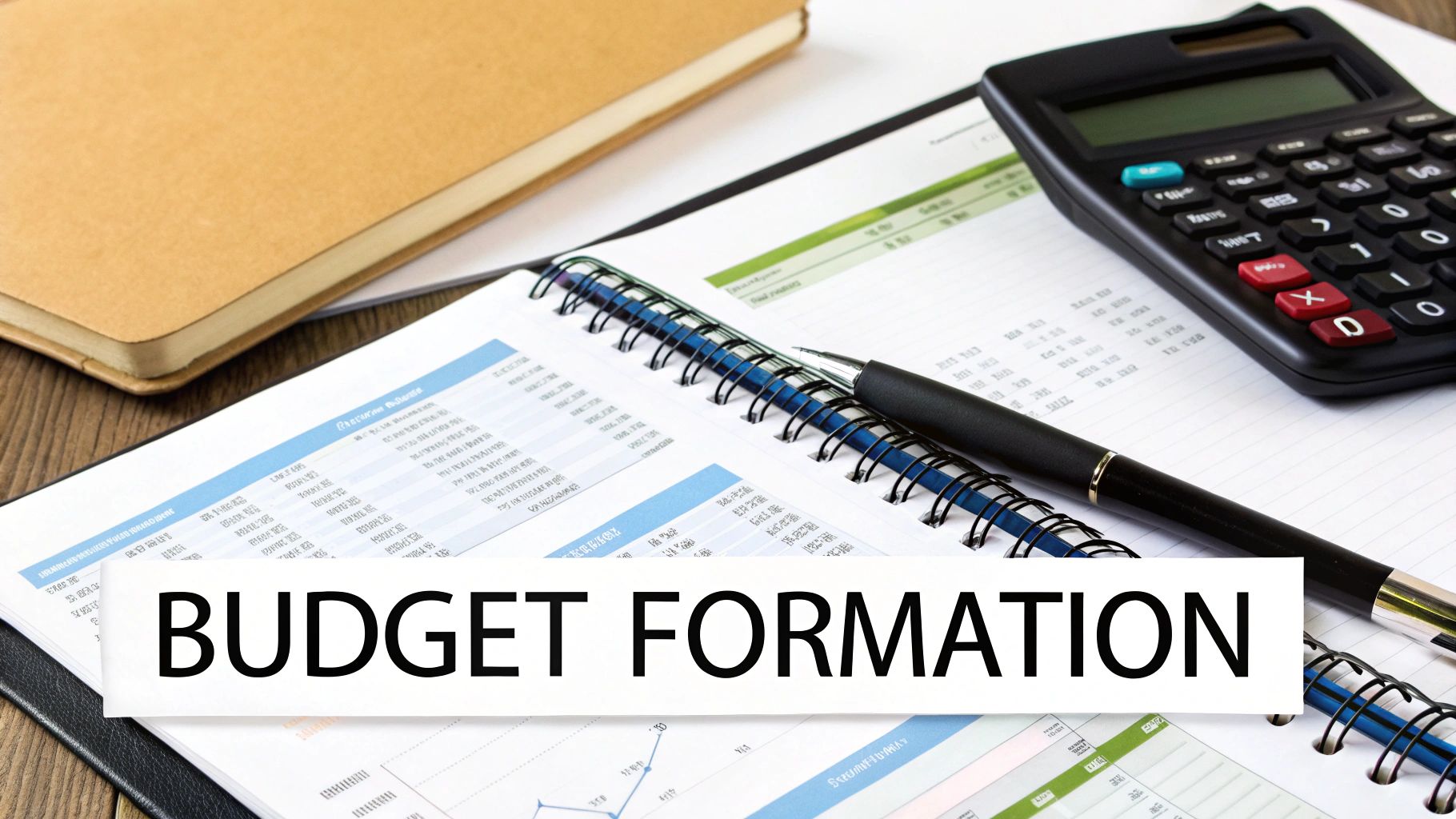 Une personne calculant un budget sur une tablette, avec des graphiques en arrière-plan.