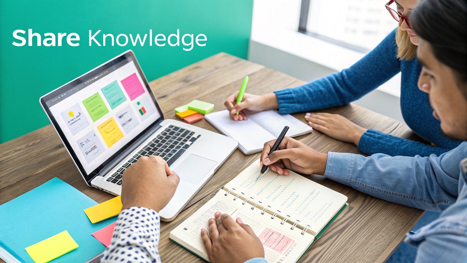 Three people collaborating at a table with a laptop, notebooks, and sticky notes, sharing knowledge.