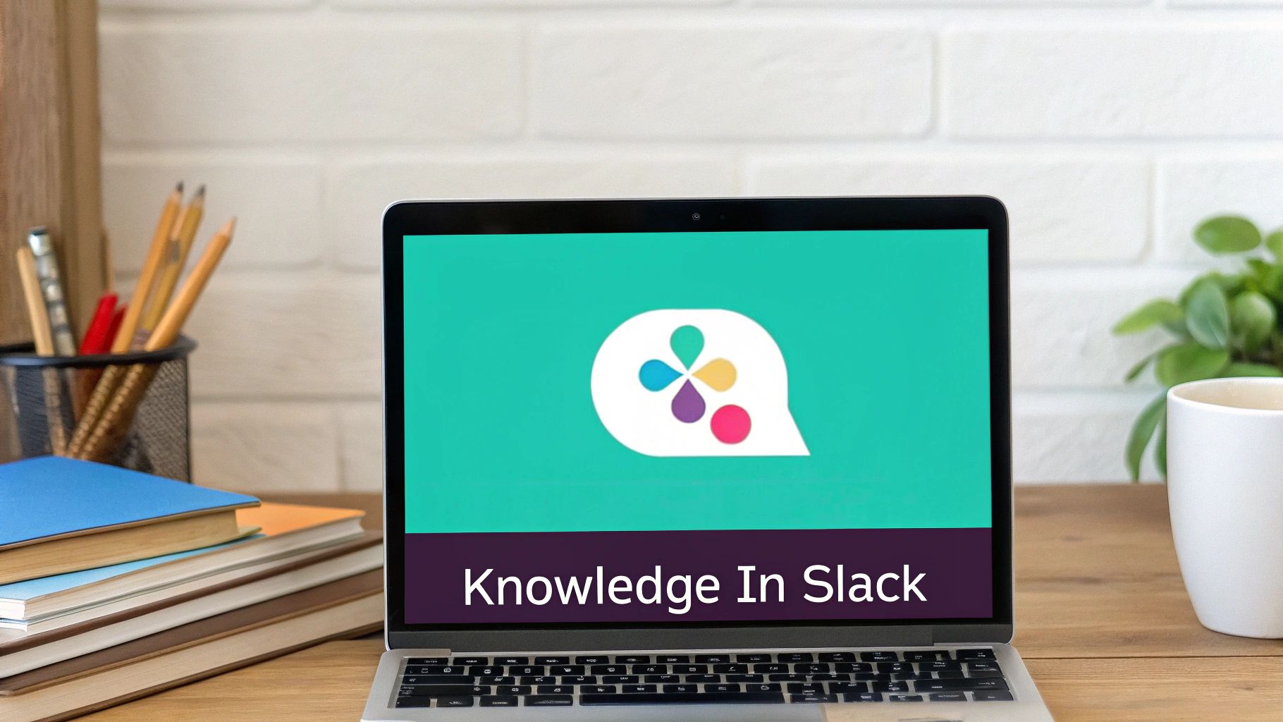 A laptop screen showing 'Knowledge In Slack' with a colorful logo on a wooden desk.