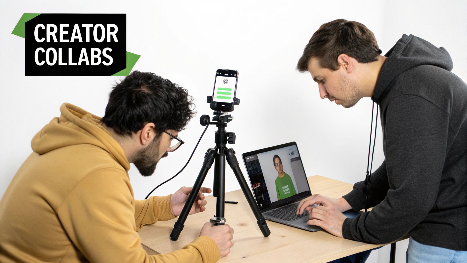 Two men collaborating on digital content creation, using a laptop with a virtual avatar and a smartphone on a tripod.