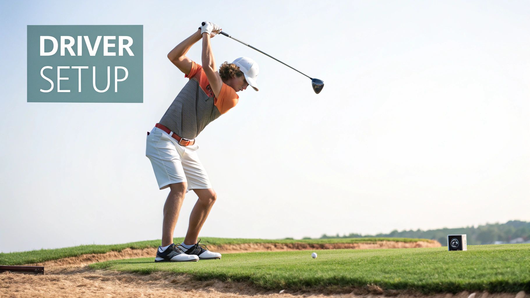 Golfer demonstrating proper driver setup stance and positioning on tee box at golf course