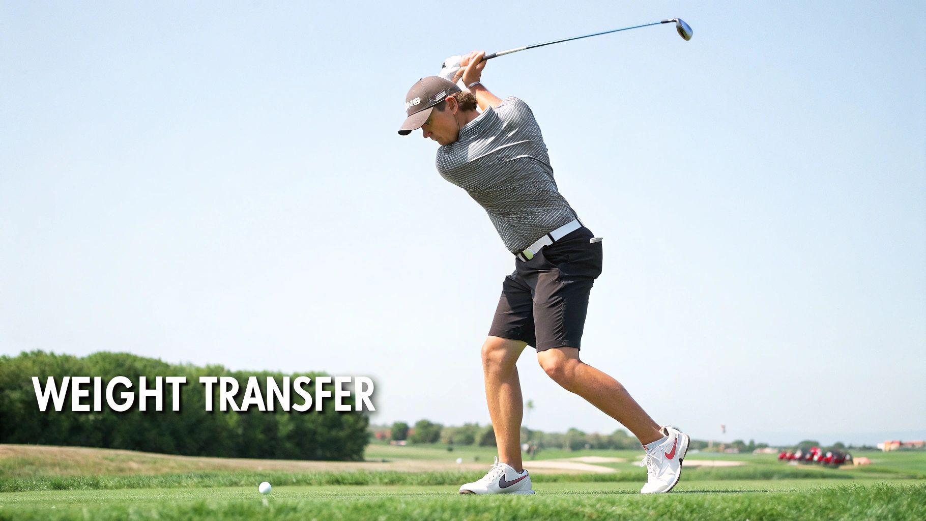 A male golfer in mid-swing with a driver on a sunny golf course, demonstrating weight transfer.