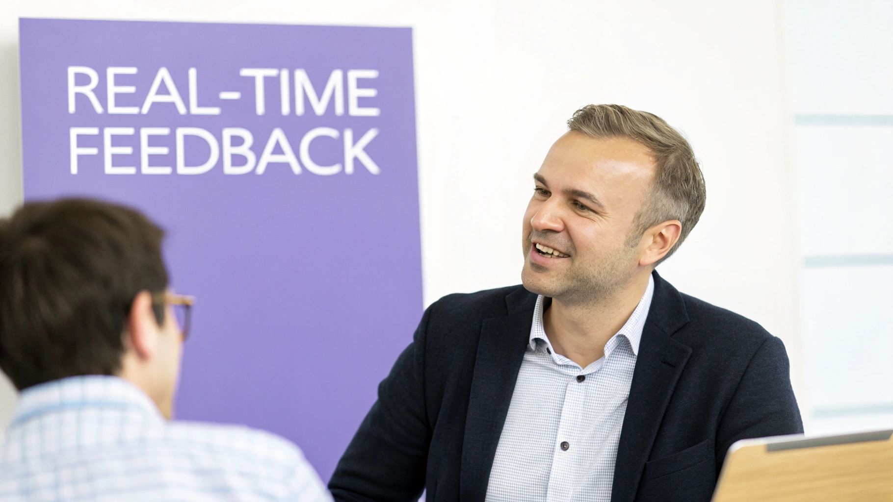 A team leader giving a high-five to a smiling employee in a bright, collaborative office space, symbolizing positive recognition.