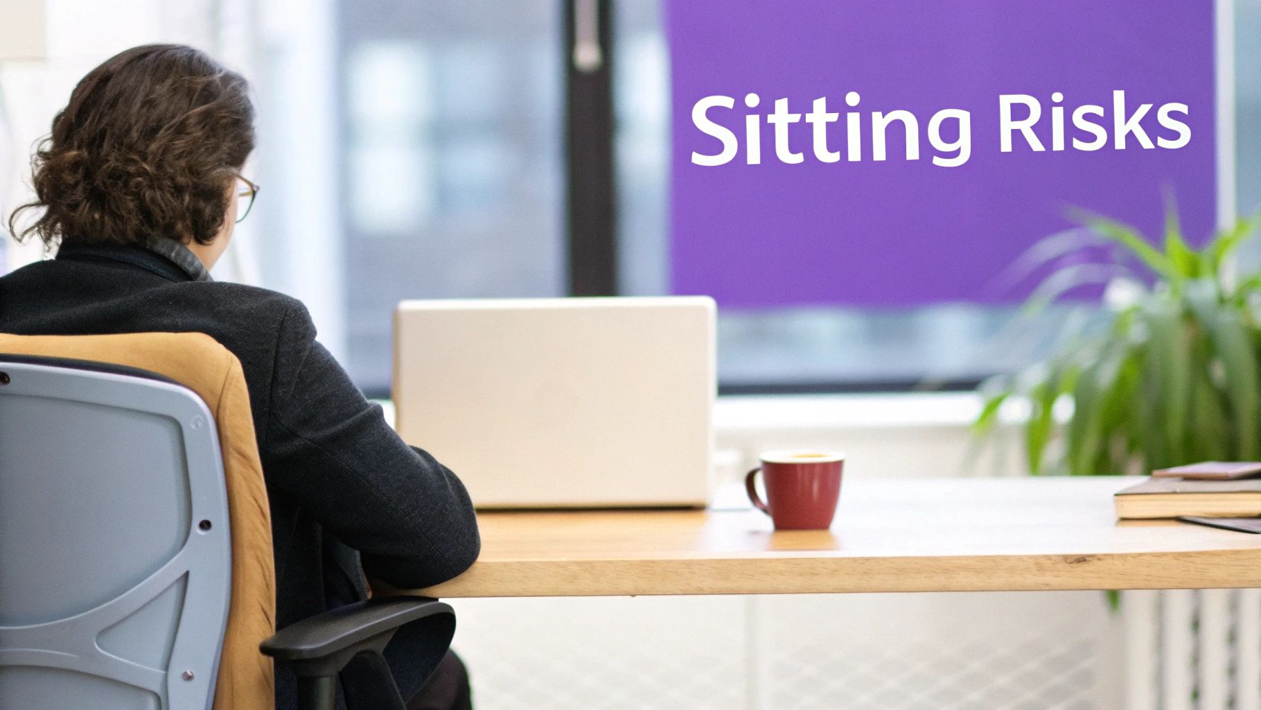 A person sitting at a desk, looking tired and stressed from prolonged computer work.