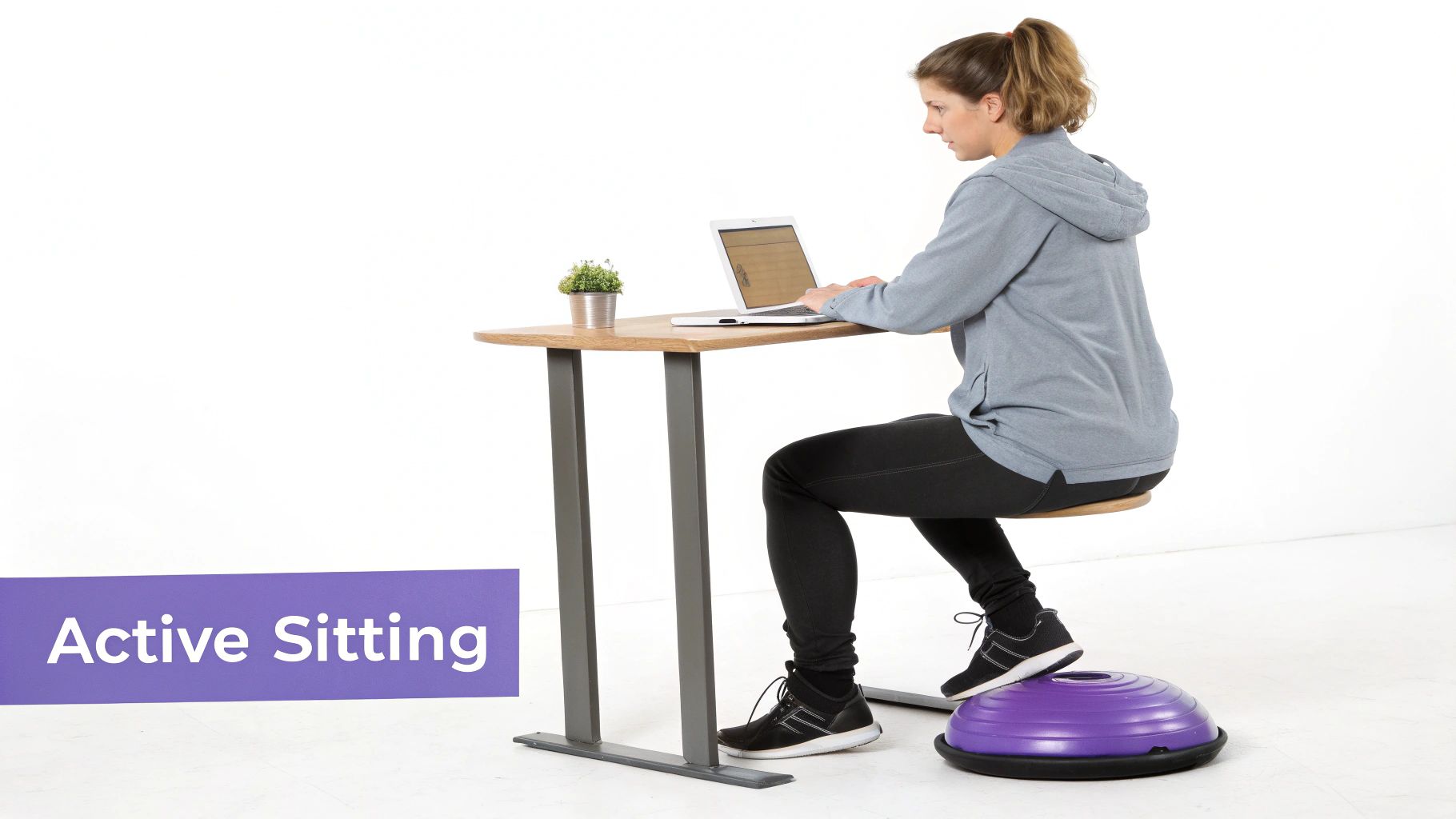 Person sitting at a desk with correct posture
