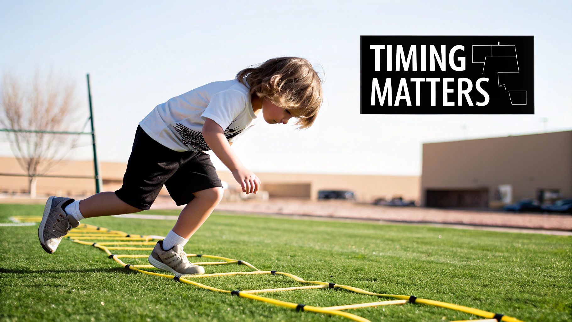 A young boy practices agility ladder drills on a green field under a clear sky.