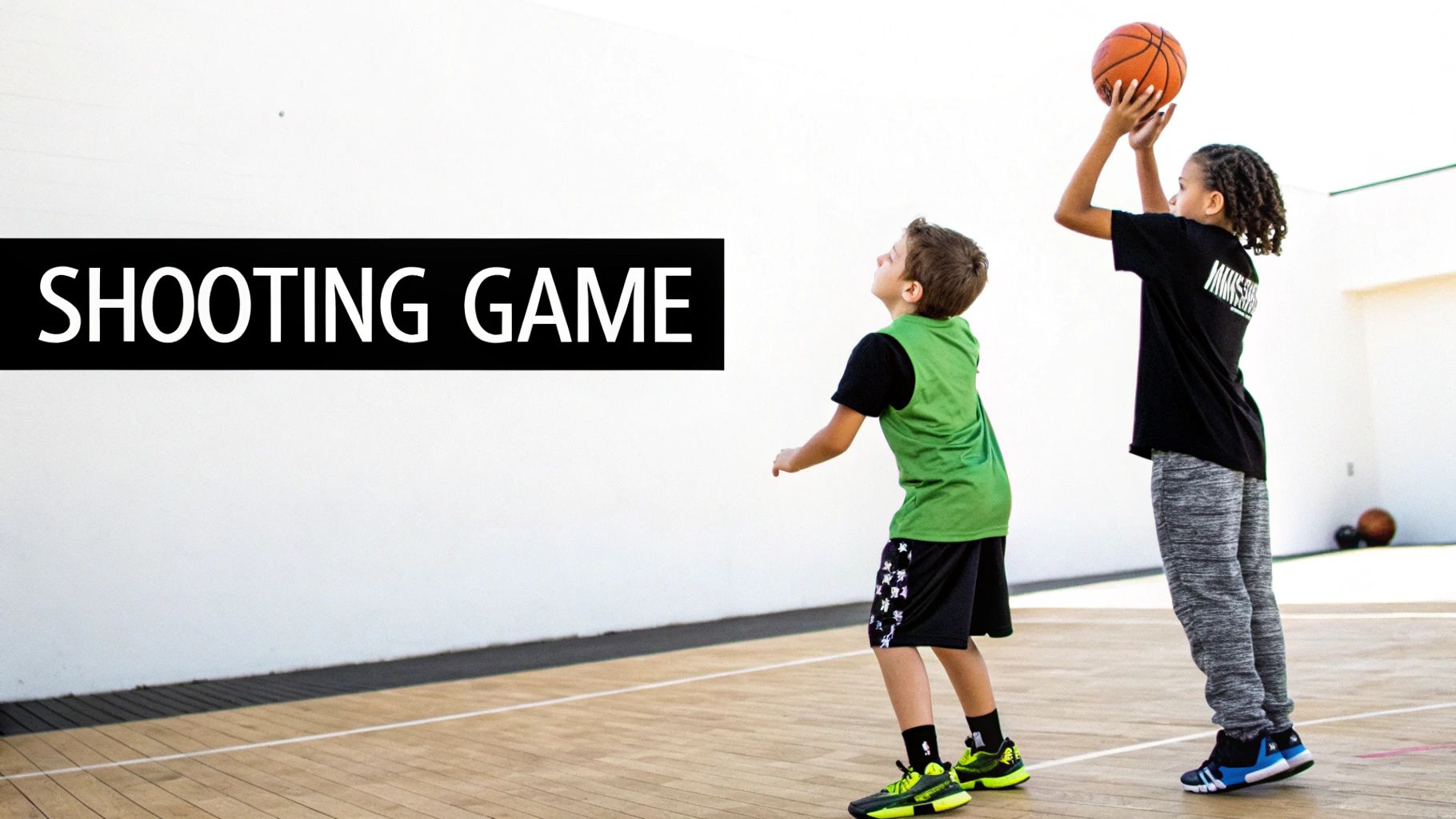 Two young kids playing basketball on a court, one shooting a ball, with 'SHOOTING GAME' text.