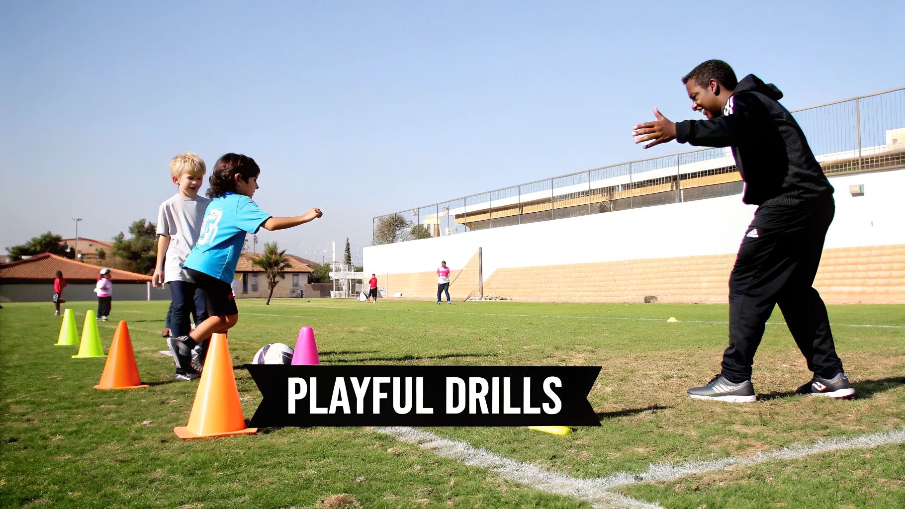 Young children participate in playful soccer drills with a coach on a sunny field.