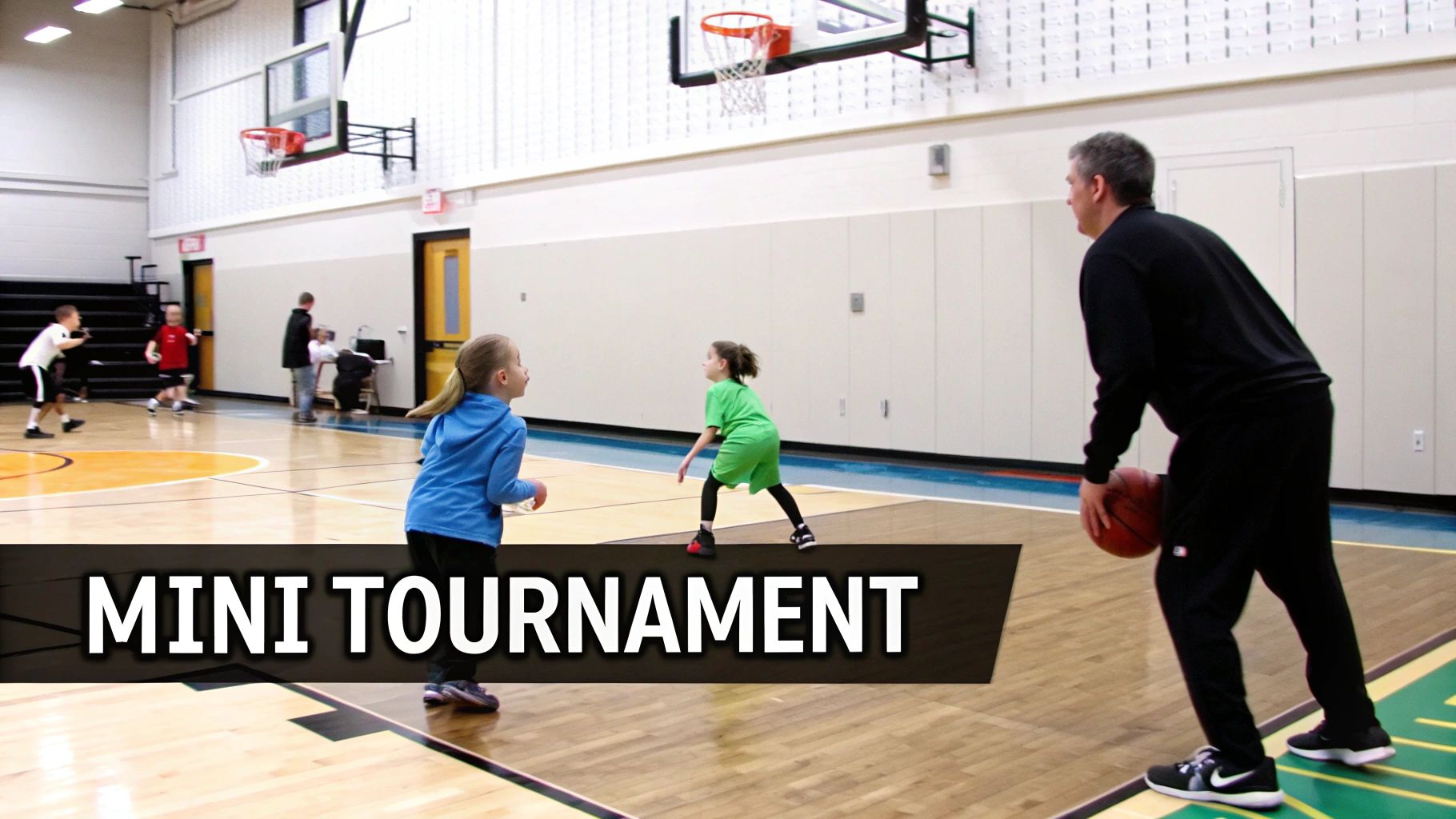 Children playing basketball with an adult coach on a court during a mini tournament.