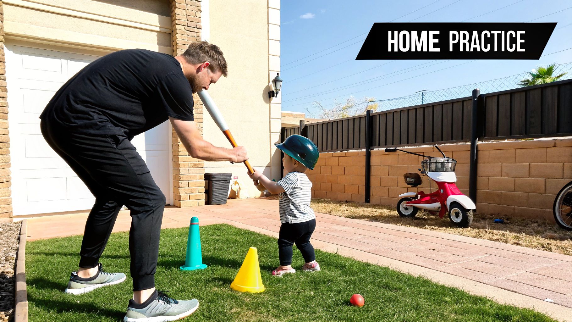 A father teaches his young child to play T-ball in their backyard, wearing a helmet.