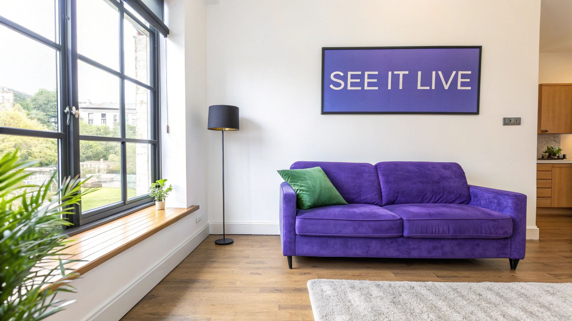 A modern room featuring a vibrant purple sofa, green pillow, floor lamp, and large window with outdoor view.