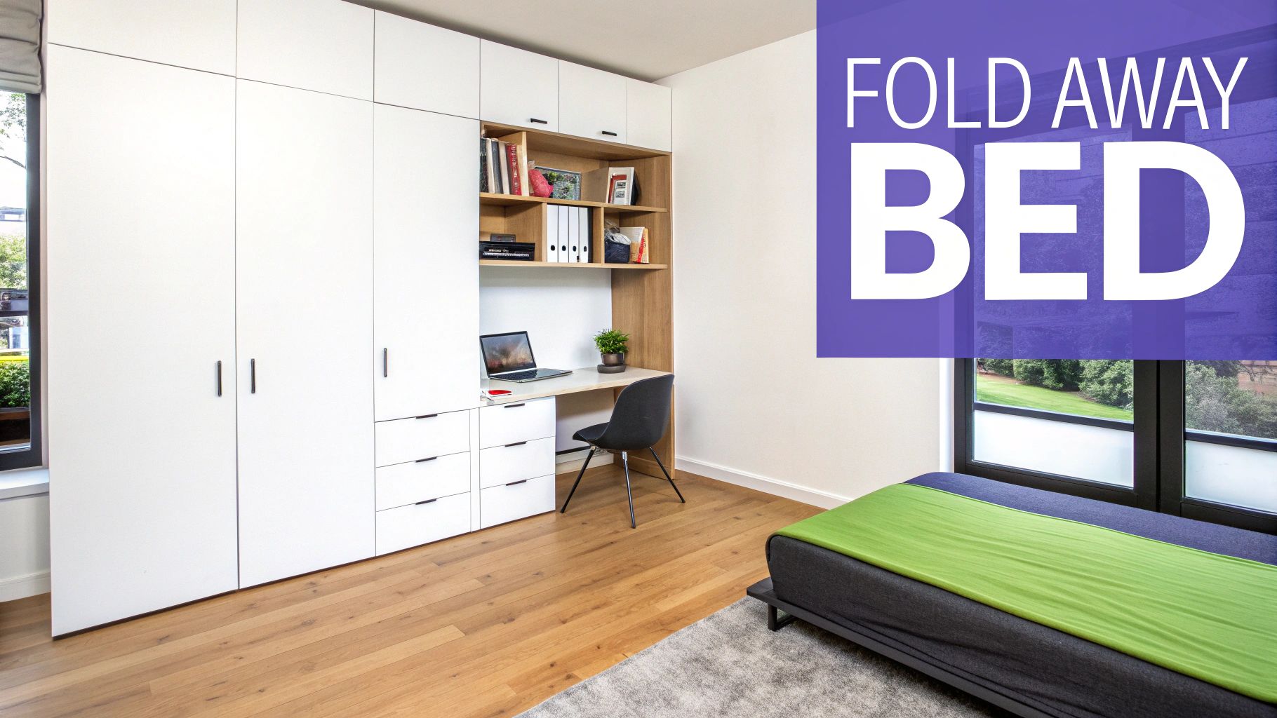 A modern room featuring a white built-in wardrobe, a home office desk, and a fold-away bed.