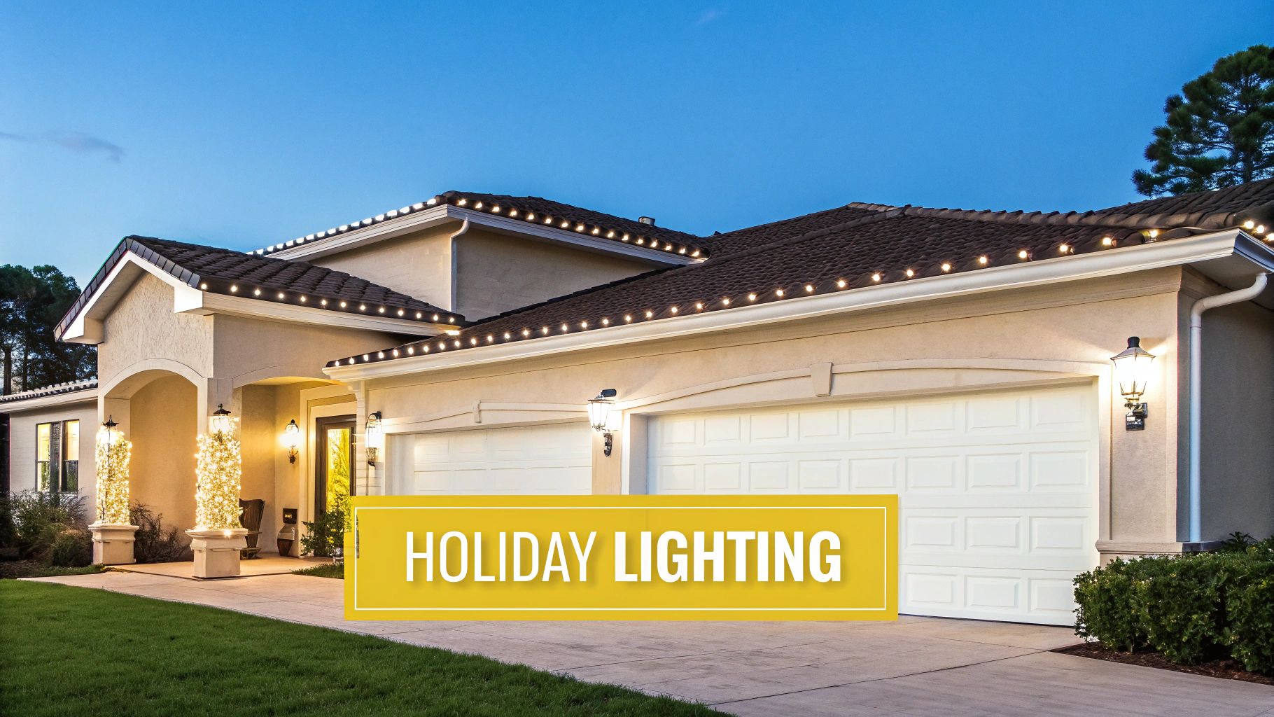 A Homeowner's Guide to Exterior Landscape Lighting in Knoxville A house beautifully decorated with festive holiday lights on its roofline and front porch pillars at dusk.