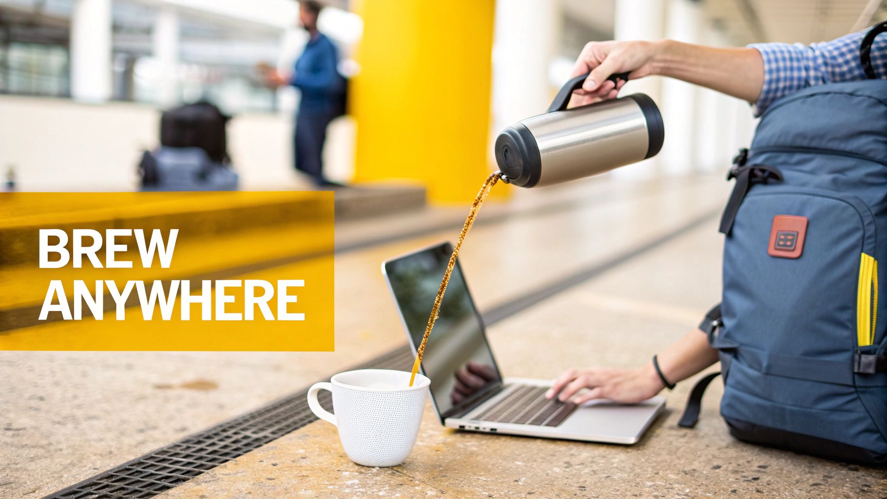 Person pouring coffee from insulated thermos into white mug while working on laptop outdoors
