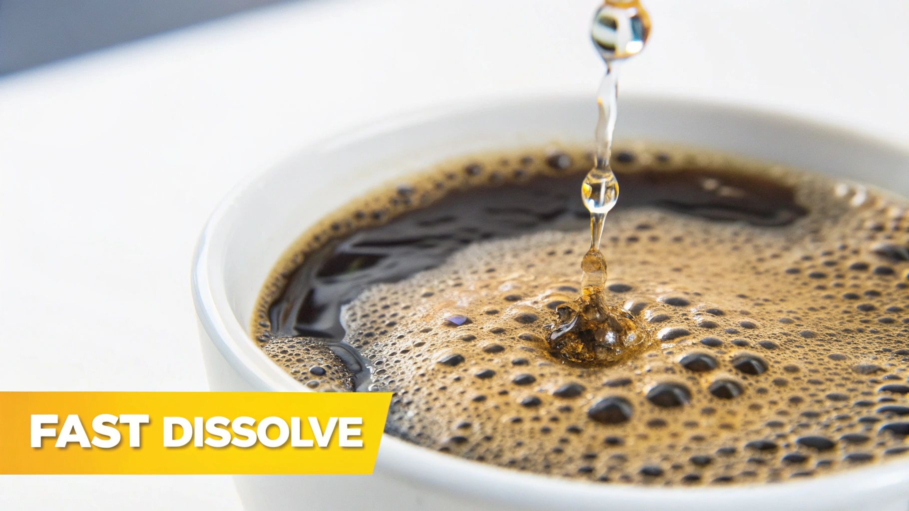 A close-up of a spoon stirring instant coffee granules as they dissolve in a white mug of hot water.